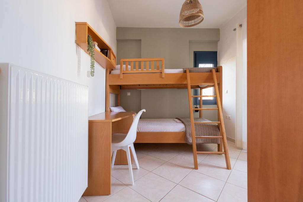 Postel nebo postele na pokoji v ubytování Frosini Seafront Loft