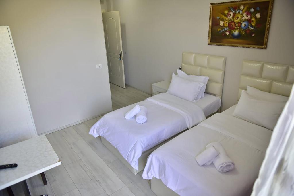 Postel nebo postele na pokoji v ubytování Buna Park Hotel