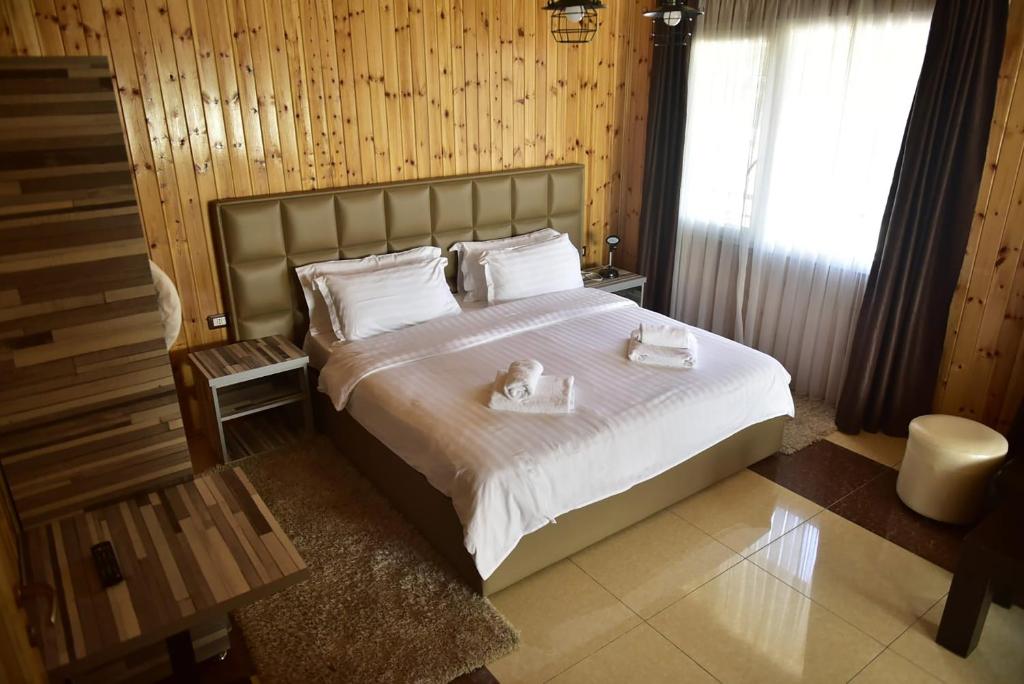 Postel nebo postele na pokoji v ubytování Buna Park Hotel