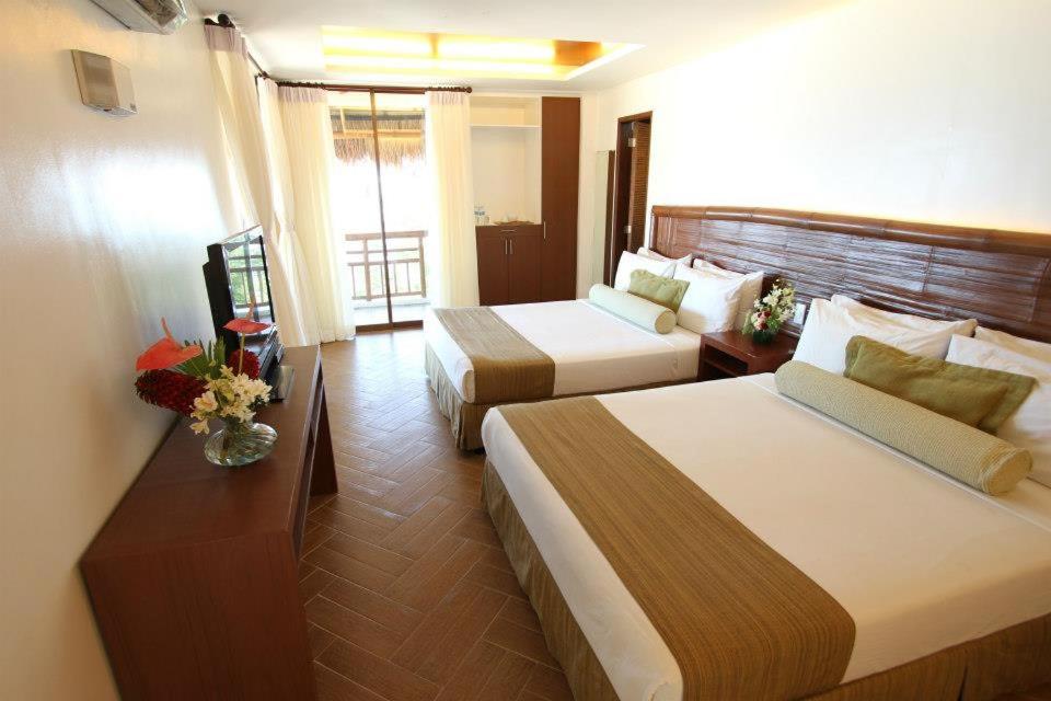 Postel nebo postele na pokoji v ubytování Acuaverde Beach Resort