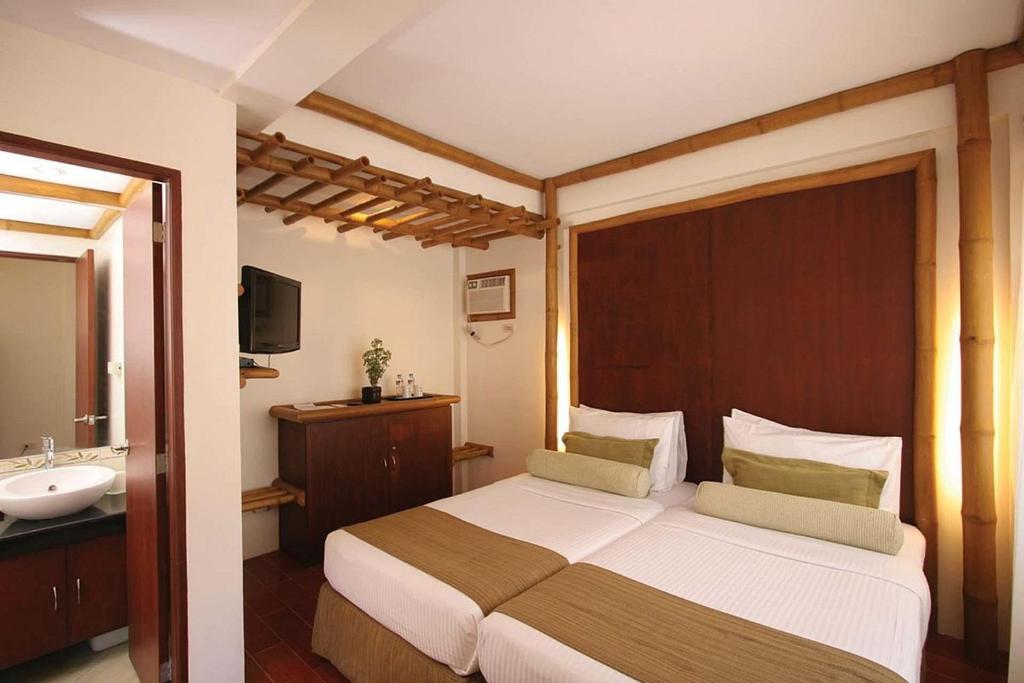 Postel nebo postele na pokoji v ubytování Acuaverde Beach Resort