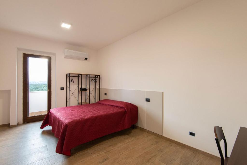 Postel nebo postele na pokoji v ubytování Green Residence Villa Assunta