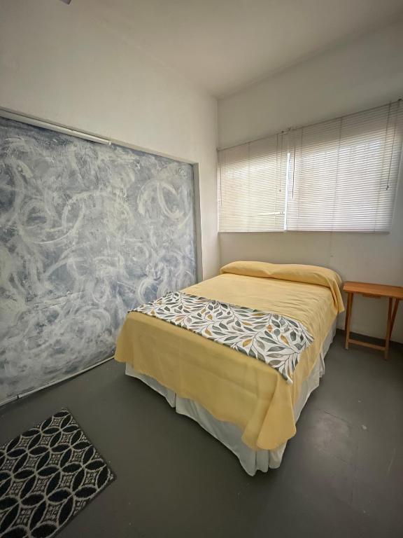 Postel nebo postele na pokoji v ubytování Vive Alegria Hostel
