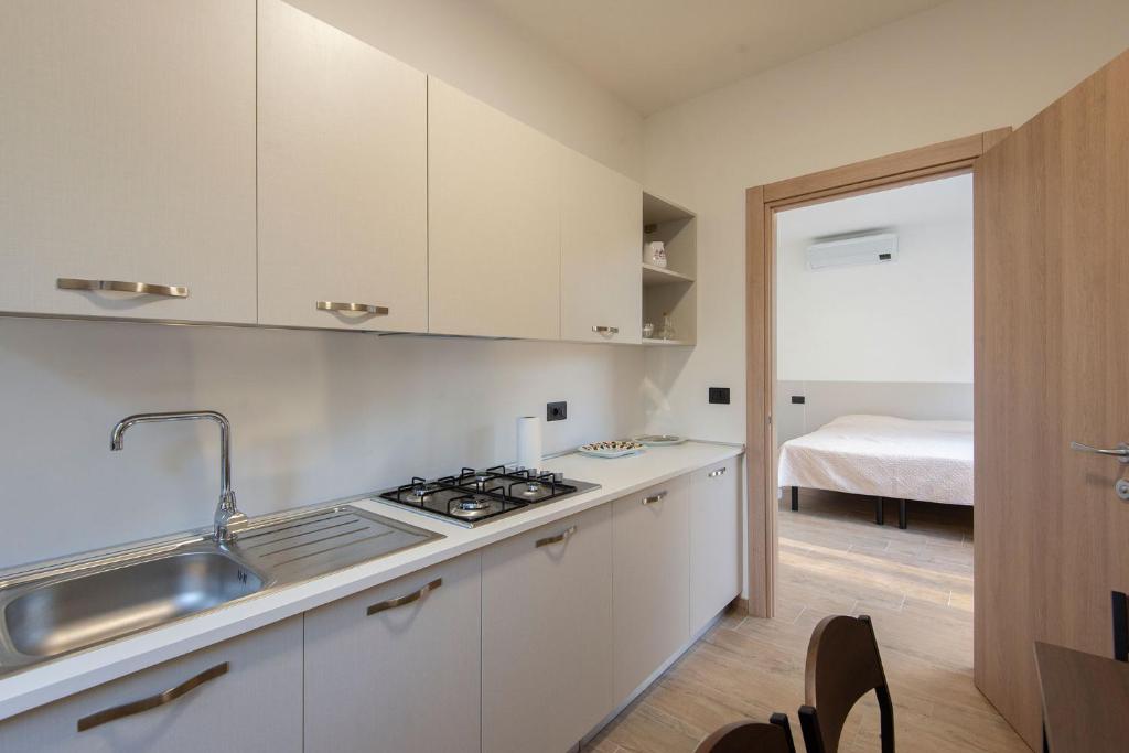 Kuchyň nebo kuchyňský kout v ubytování Green Residence Villa Assunta