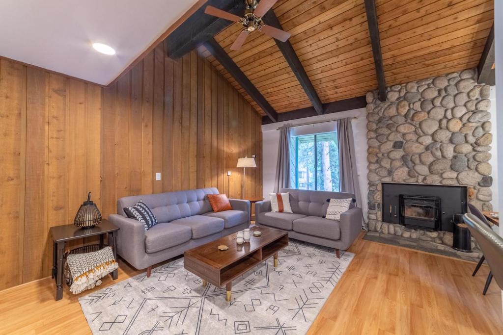 a living room with two couches and a fireplace at #525 Walk to Golf Course, Midtown, Stunning Condo in Mammoth Lakes