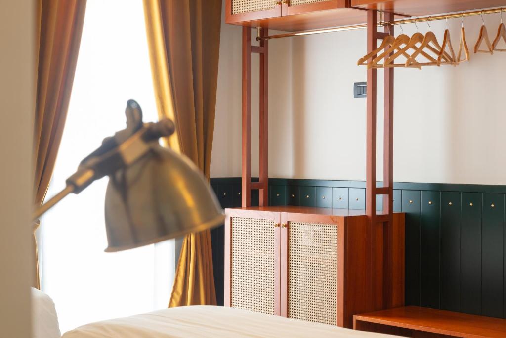 Postel nebo postele na pokoji v ubytování Hotel Ghalà