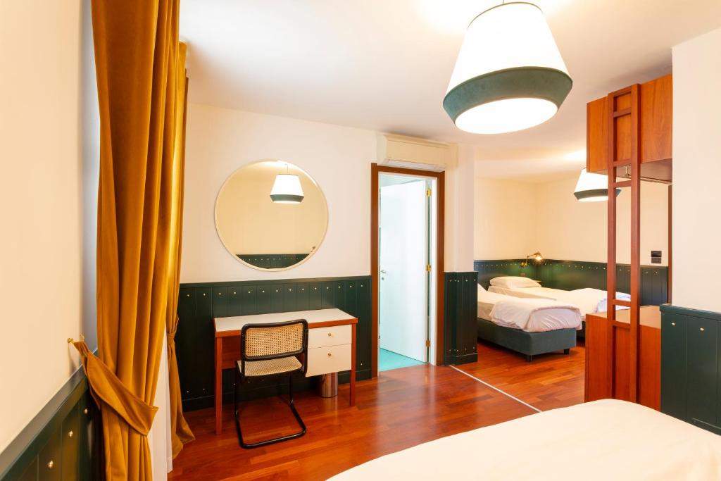 Postel nebo postele na pokoji v ubytování Hotel Ghalà