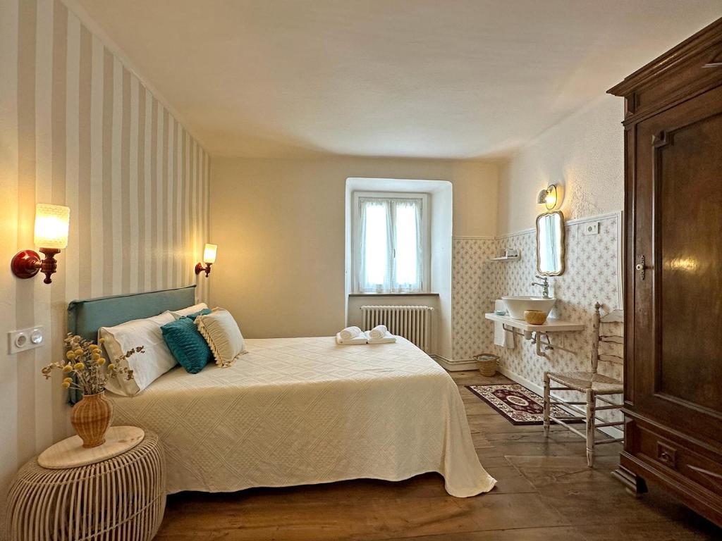 a bedroom with a bed and a sink in it at ETXEALE in Valcarlos