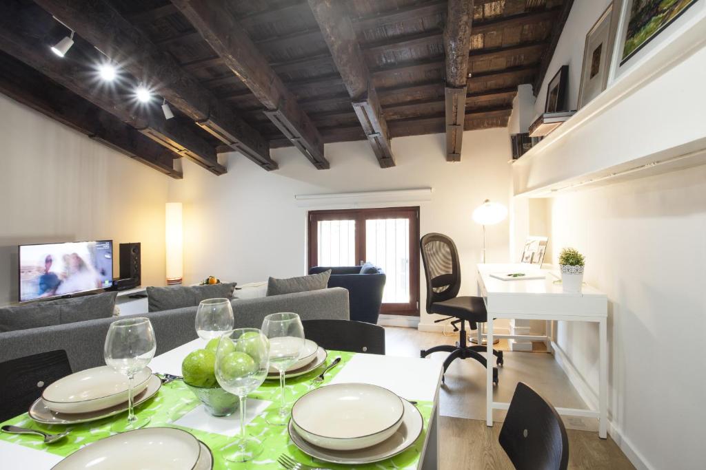a living room with a table and a couch at SingularStays San Vicente in Valencia