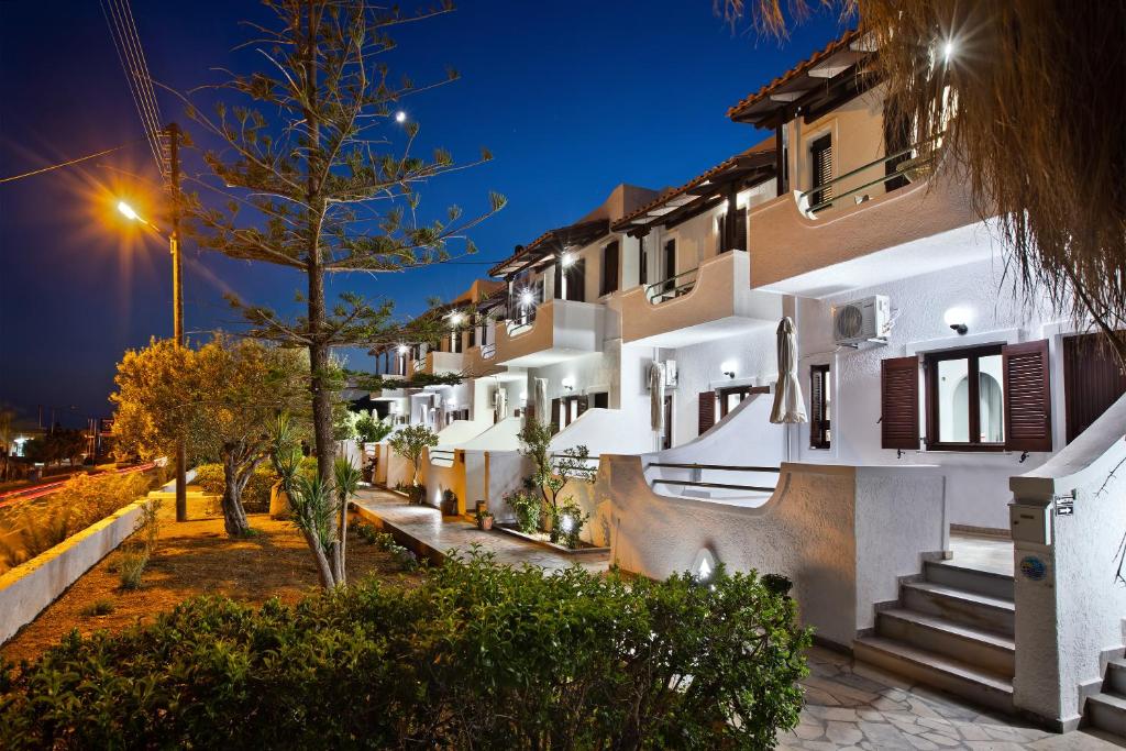 a row of apartment buildings at night at Apartment with garden view - Creta in Ferma