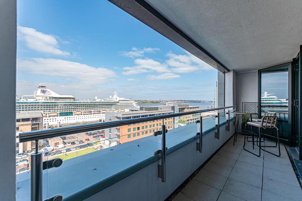 a balcony with a view of a cruise ship at Luxurious 1 Bed - RIVER VIEW in Liverpool