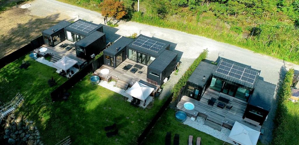 an aerial view of a house with solar panels on it at 郷音 ～G.O.A.T～ in Tsuru 