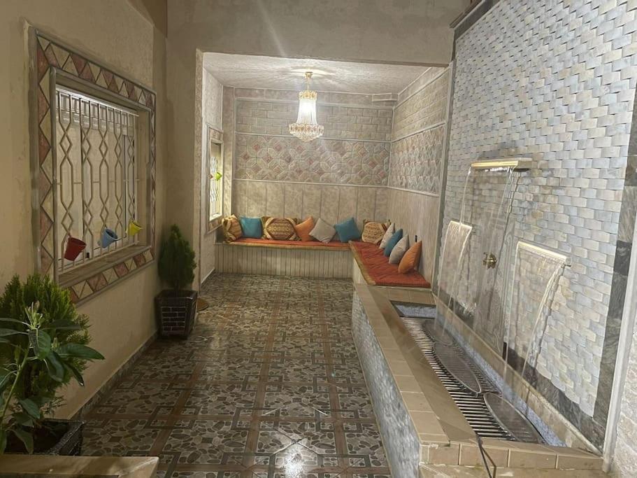 a hallway with a couch in a room at Apartment in Larache Marokko in Larache