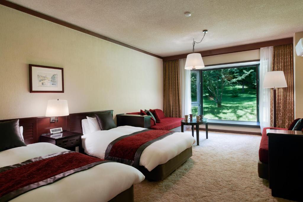 Postel nebo postele na pokoji v ubytování Tateshina Tokyu Hotel