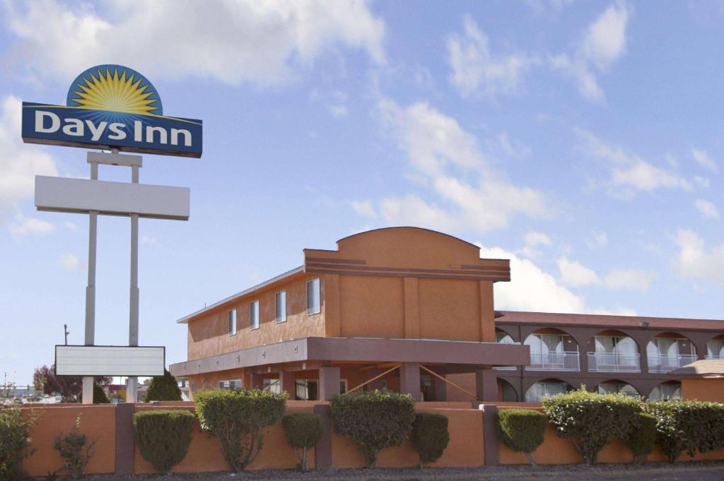 a building with a days inn sign in front of it at Days Inn by Wyndham Socorro in Socorro