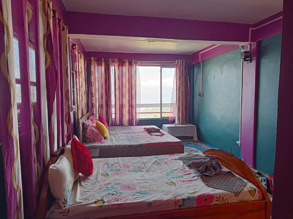 Postel nebo postele na pokoji v ubytování Wonder Hill Parivaar homestay