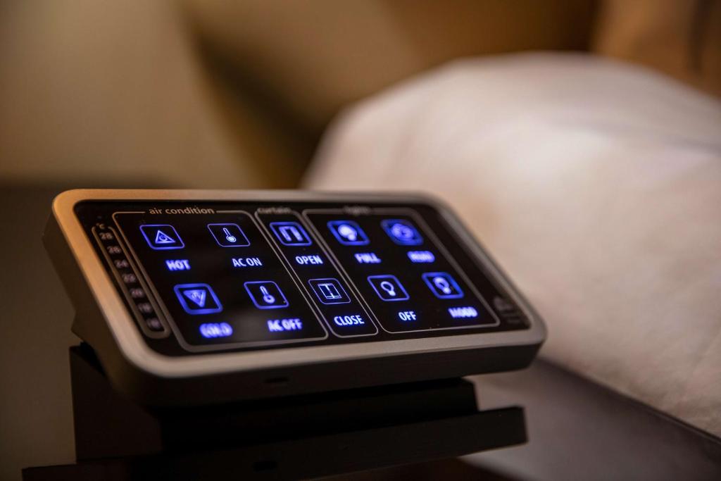 a close up of a cell phone sitting on a table at Park Plaza London Riverbank in London