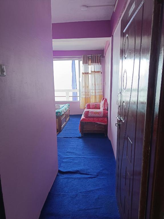 Postel nebo postele na pokoji v ubytování Wonder Hill Parivaar homestay