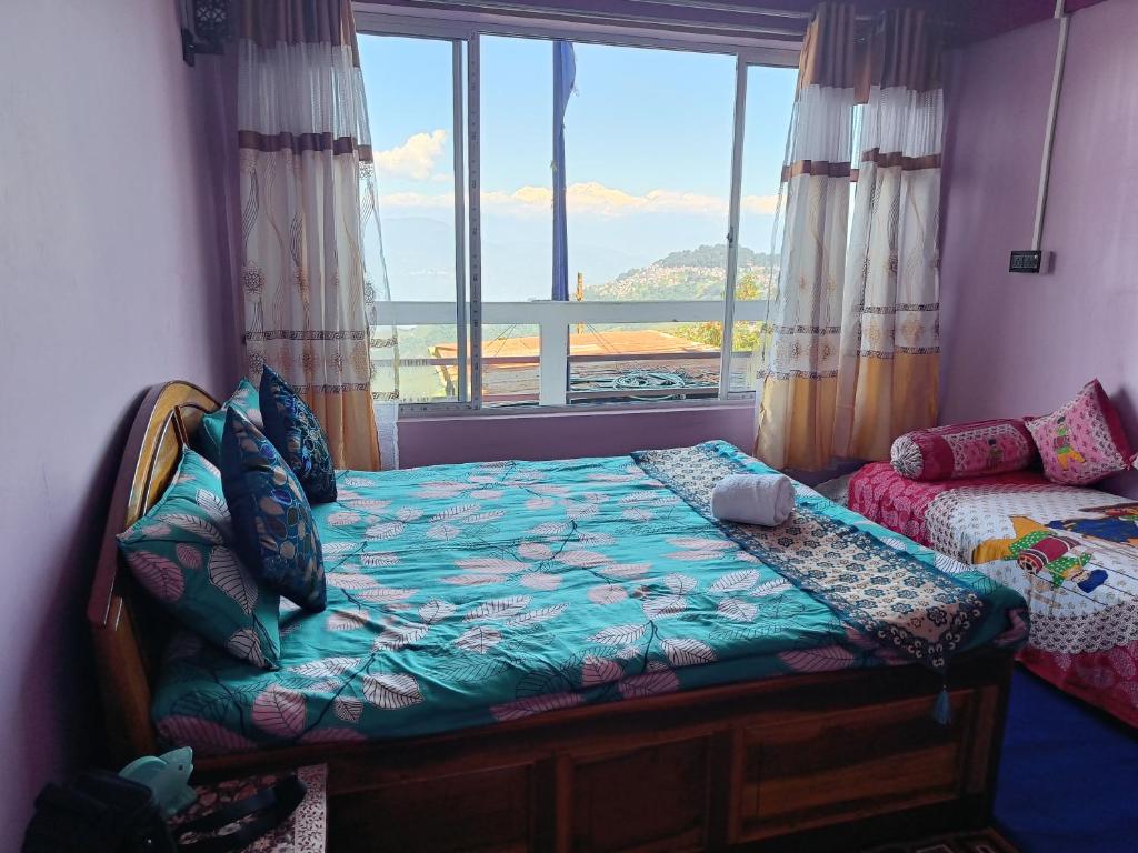 Postel nebo postele na pokoji v ubytování Wonder Hill Parivaar homestay