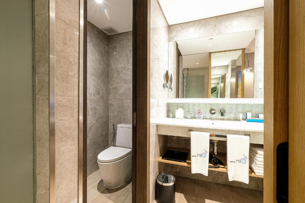 Koupelna v ubytování Hotel H2O