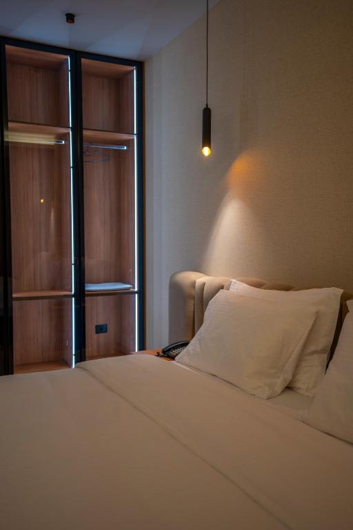 Voodi või voodid majutusasutuse Duomo Resort toas