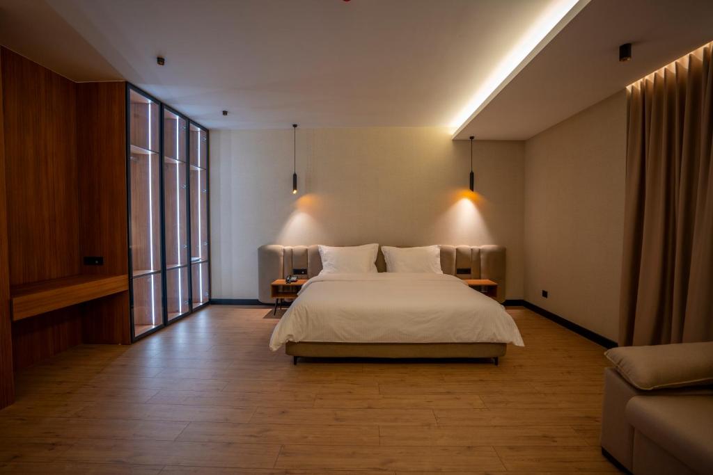 Voodi või voodid majutusasutuse Duomo Resort toas