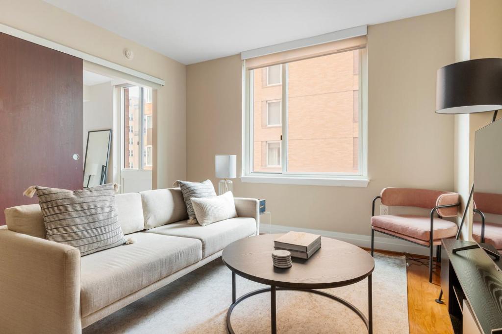 a living room with a couch and a table at Foggy Bottom 1br w wd pool gym nr Georgetown WDC-658 in Washington, D.C.