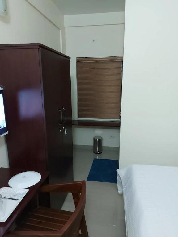 Postel nebo postele na pokoji v ubytování Masterkey Deluxe Rooms