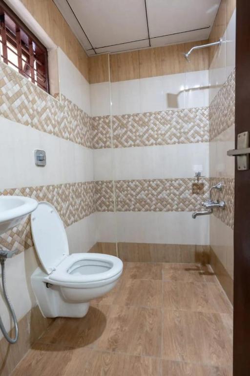 Koupelna v ubytování Masterkey Deluxe Rooms
