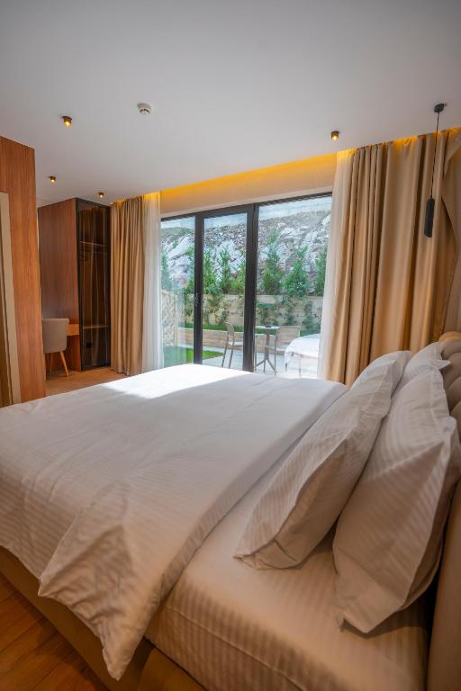 Voodi või voodid majutusasutuse Duomo Resort toas