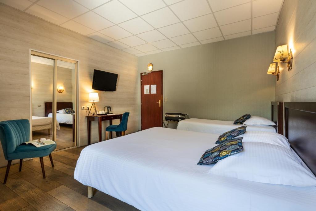 Postel nebo postele na pokoji v ubytování Hotel Beau Rivage