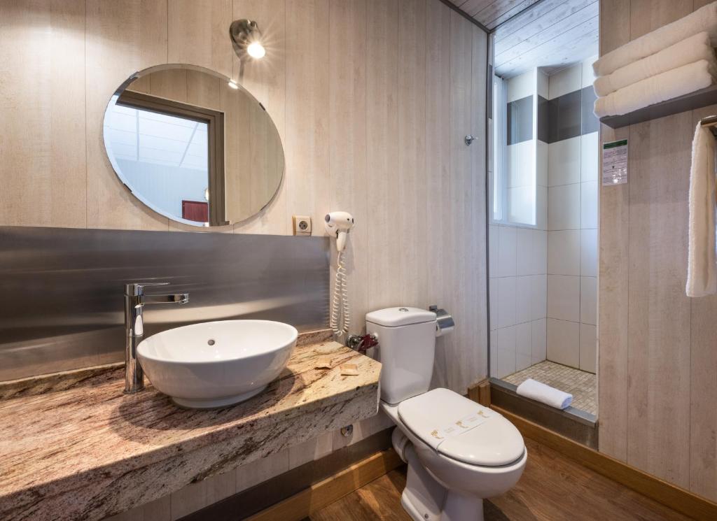 Koupelna v ubytování Hotel Beau Rivage