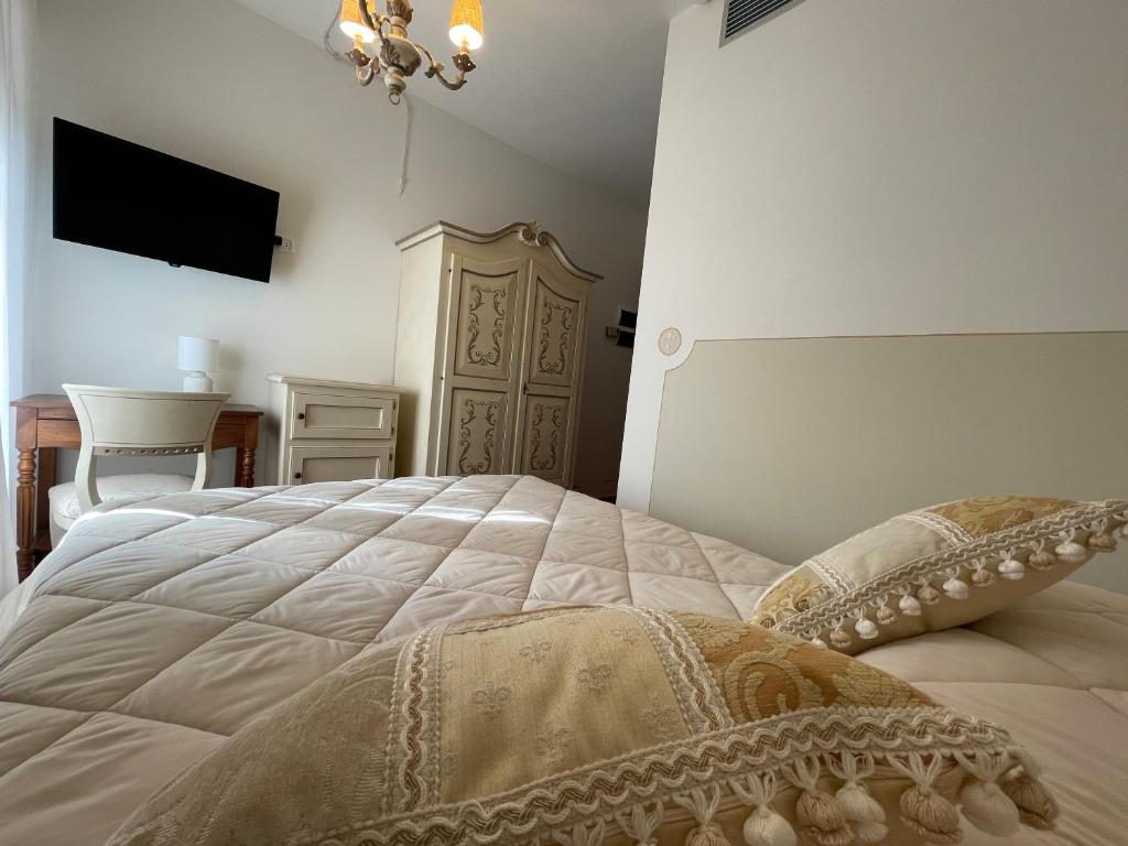 Postel nebo postele na pokoji v ubytování Hotel Rifugio la Foresta