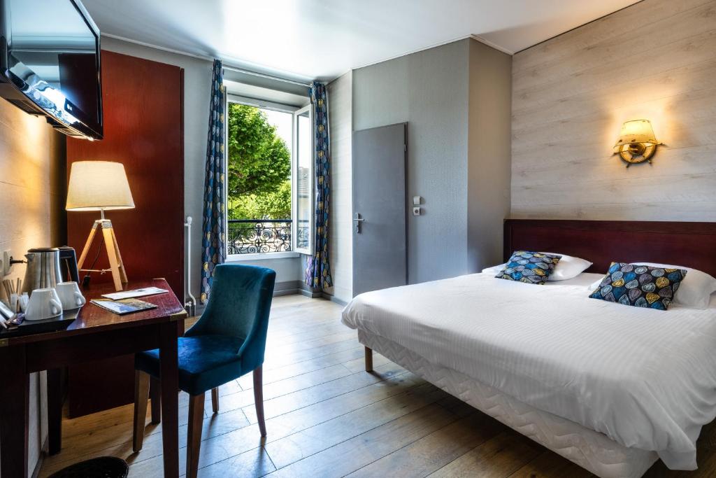 Postel nebo postele na pokoji v ubytování Hotel Beau Rivage