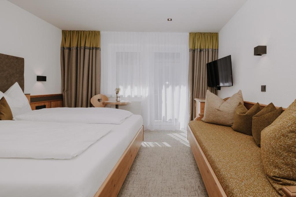 Postel nebo postele na pokoji v ubytování B&B Hotel Die Bergquelle