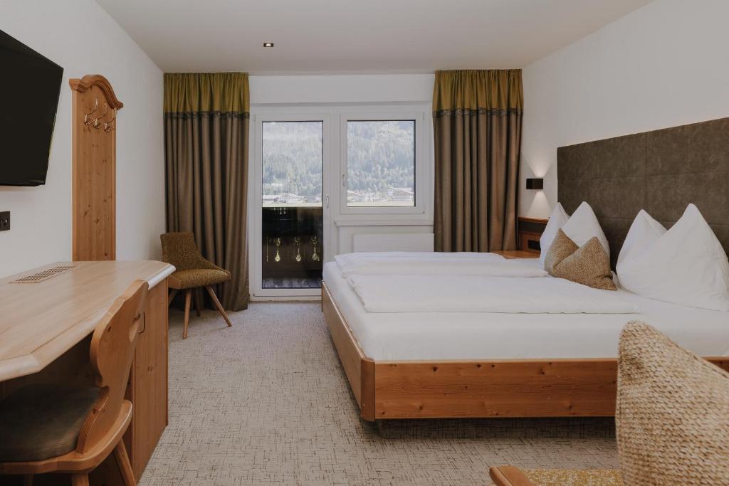 Postel nebo postele na pokoji v ubytování B&B Hotel Die Bergquelle