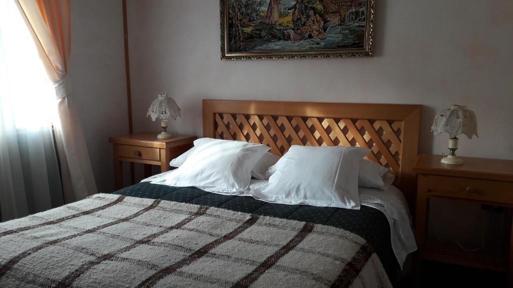 Postel nebo postele na pokoji v ubytování Hotel Mi Casa