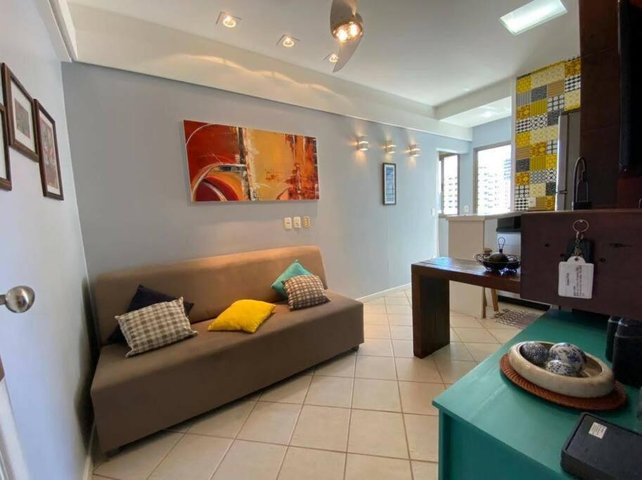a living room with a couch and a table at Ocean Flat 1006 in Vila Velha