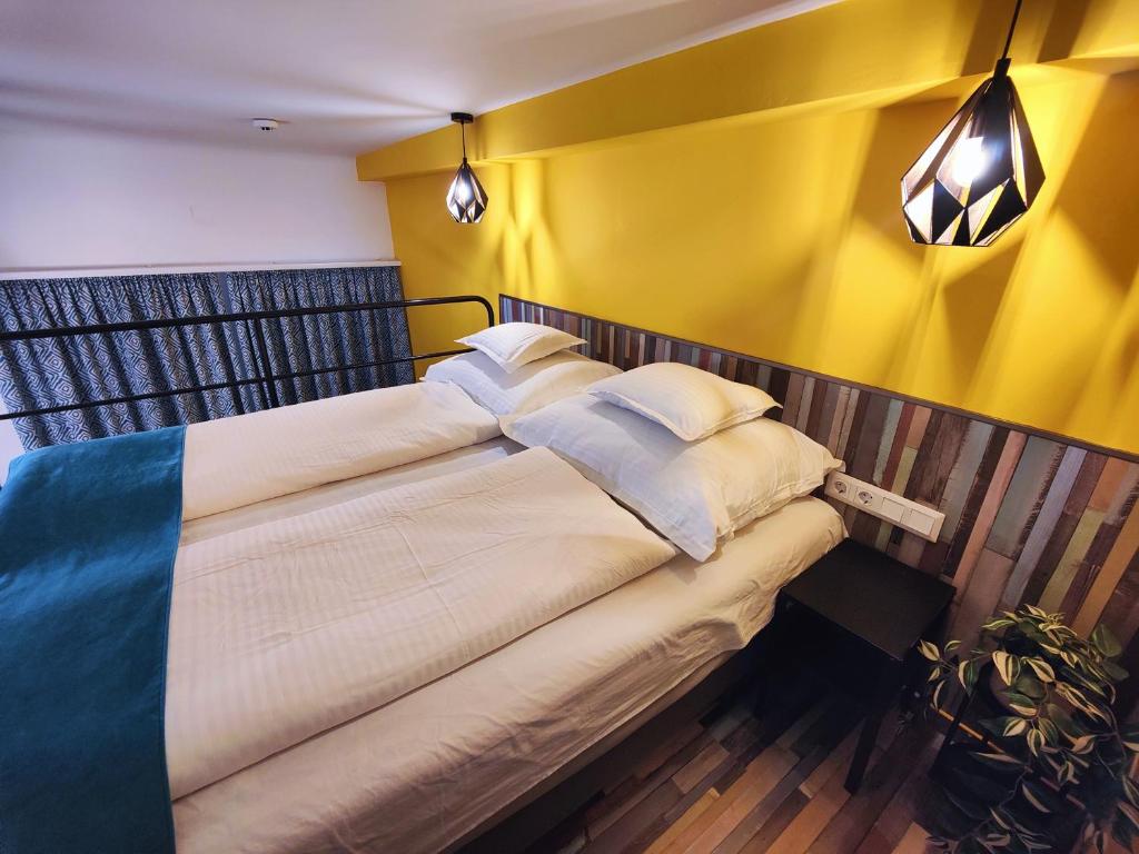 Posteľ alebo postele v izbe v ubytovaní King Apartment