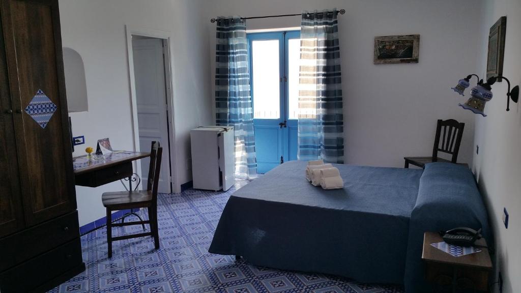 Postel nebo postele na pokoji v ubytování Hotel A Cannata