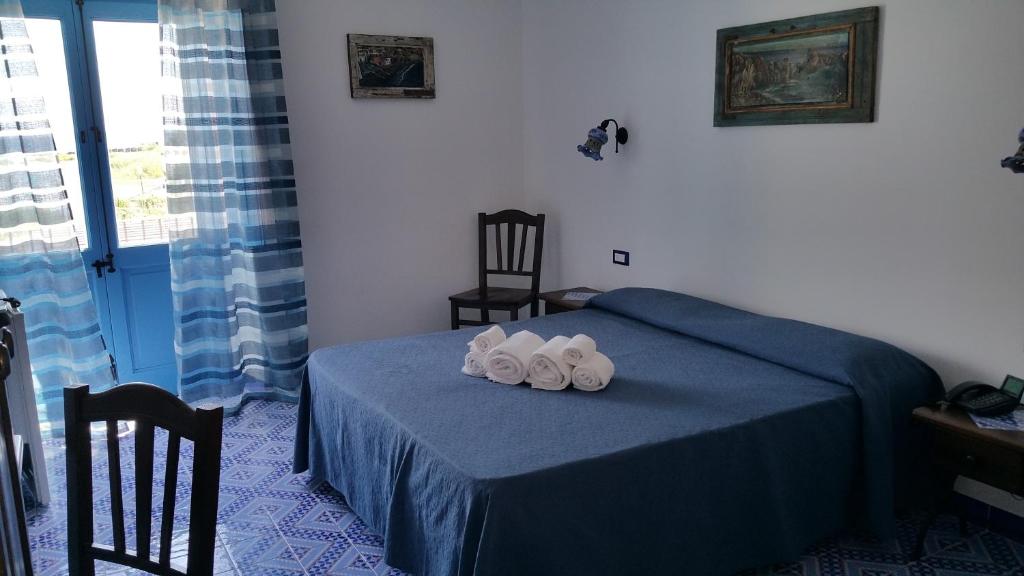 Postel nebo postele na pokoji v ubytování Hotel A Cannata