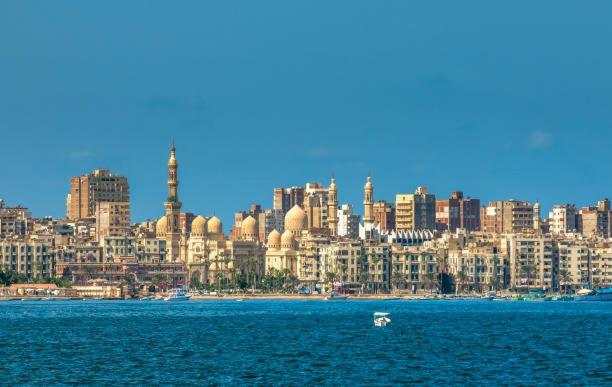 a view of a city from the water at Salvatore Rooms -Corneish Street in Alexandria