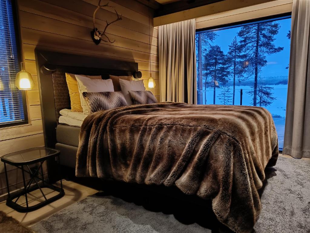Postel nebo postele na pokoji v ubytování Willa Lumia