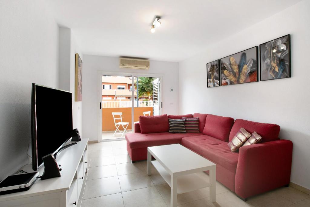 TV a/nebo společenská místnost v ubytování Beach Front Apartment Puertito