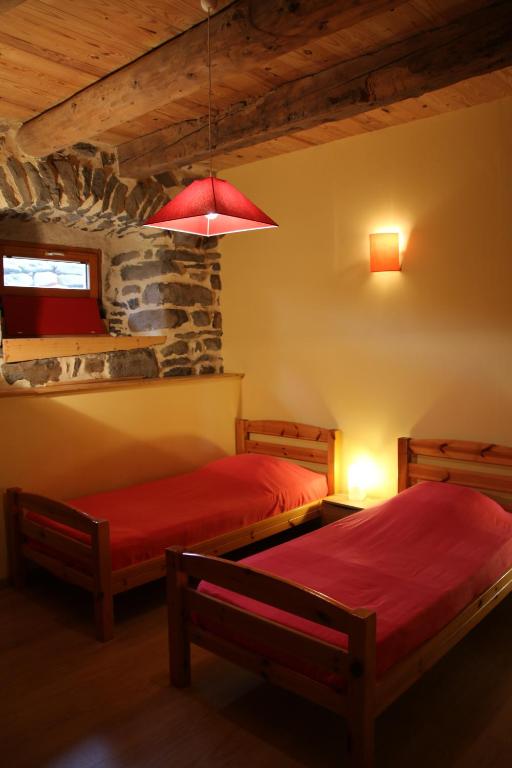 Postel nebo postele na pokoji v ubytování Gîte des Cabr'éoles
