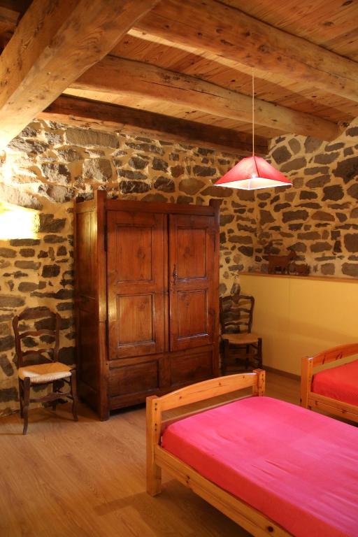Postel nebo postele na pokoji v ubytování Gîte des Cabr'éoles