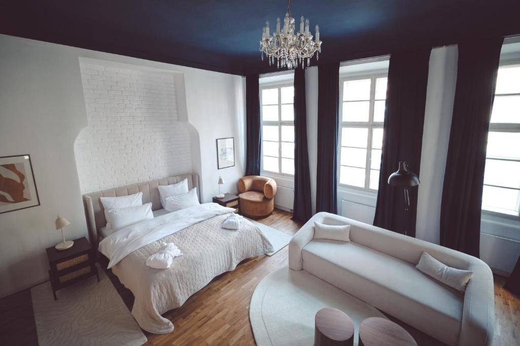 Postel nebo postele na pokoji v ubytování Domus Balthasar Boutique Hotel