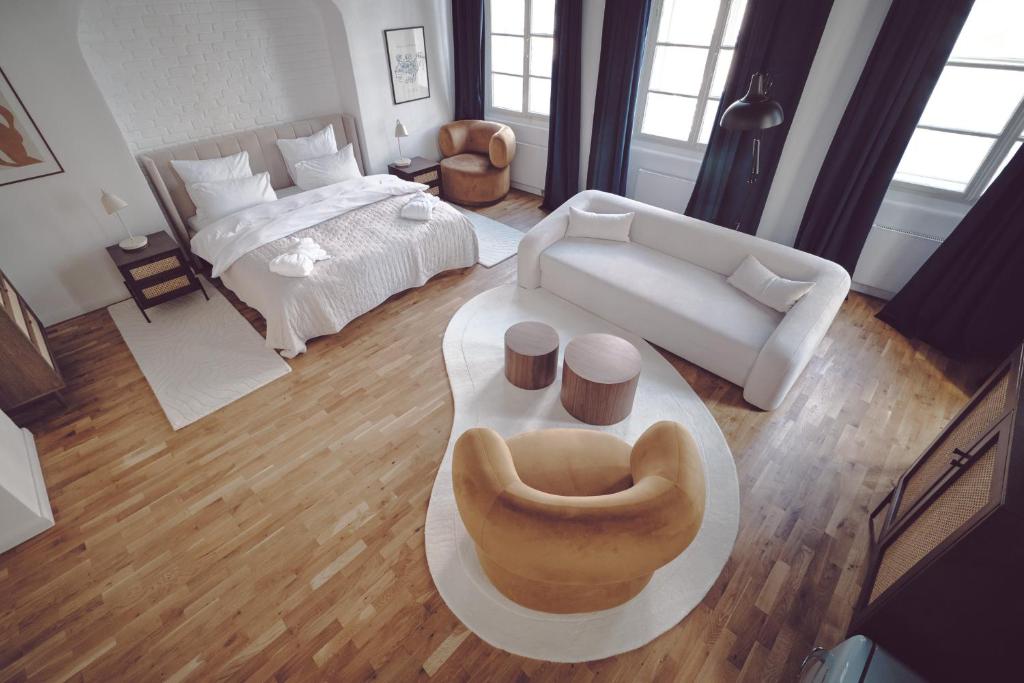 Postel nebo postele na pokoji v ubytování Domus Balthasar Boutique Hotel