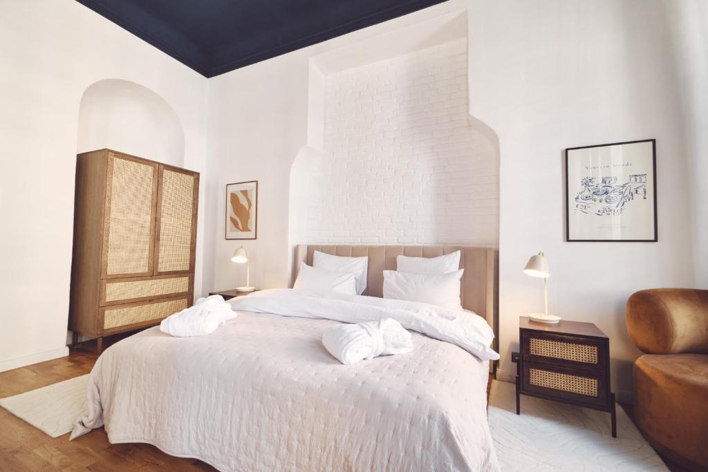 Postel nebo postele na pokoji v ubytování Domus Balthasar Boutique Hotel