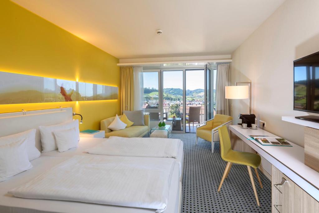 Postel nebo postele na pokoji v ubytování Sonnenhof Hotel & Spa